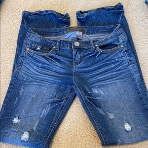 Almost Famous dark wash distressed boot cut sz 7
